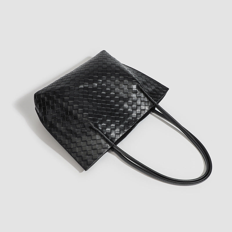 Large black woven leather-look tote bag with twin shoulder straps and matching inner pouch, detail view 4