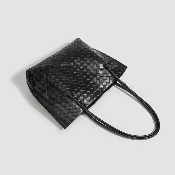 Large black woven leather-look tote bag with twin shoulder straps and matching inner pouch, detail view 4