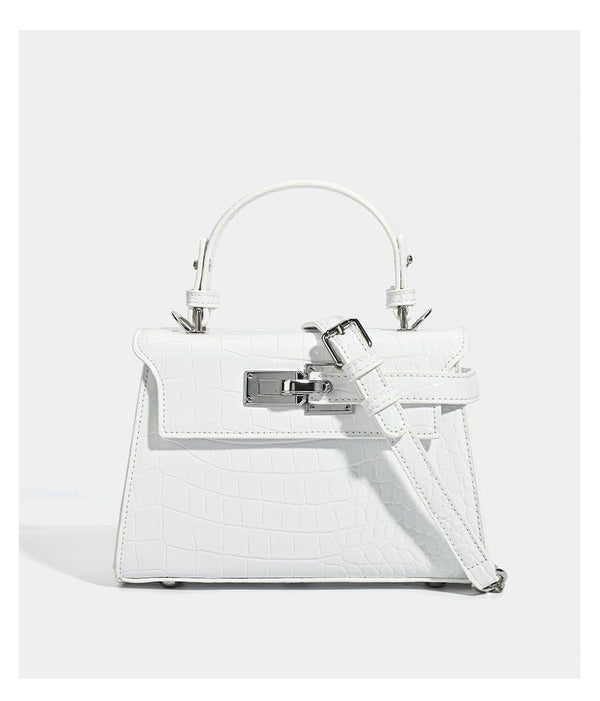 Croc-embossed mini top-handle satchel with silver turn-lock closure and adjustable crossbody strap, detail view 19