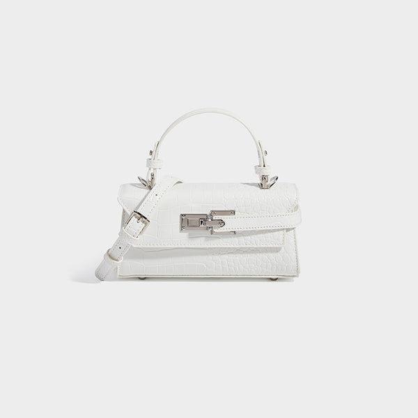 Mini-Henkeltasche mit strukturierter Form und Krokoprägung, silberfarbenem Drehverschluss und abnehmbarem Schulterriemen, Detailansicht