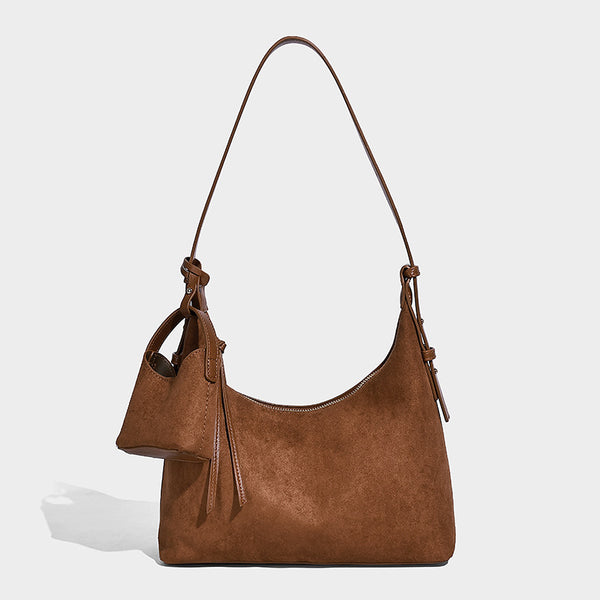Dark brown suede-look hobo shoulder bag with top zip closure, adjustable strap, and small detachable mini pouch, detail view