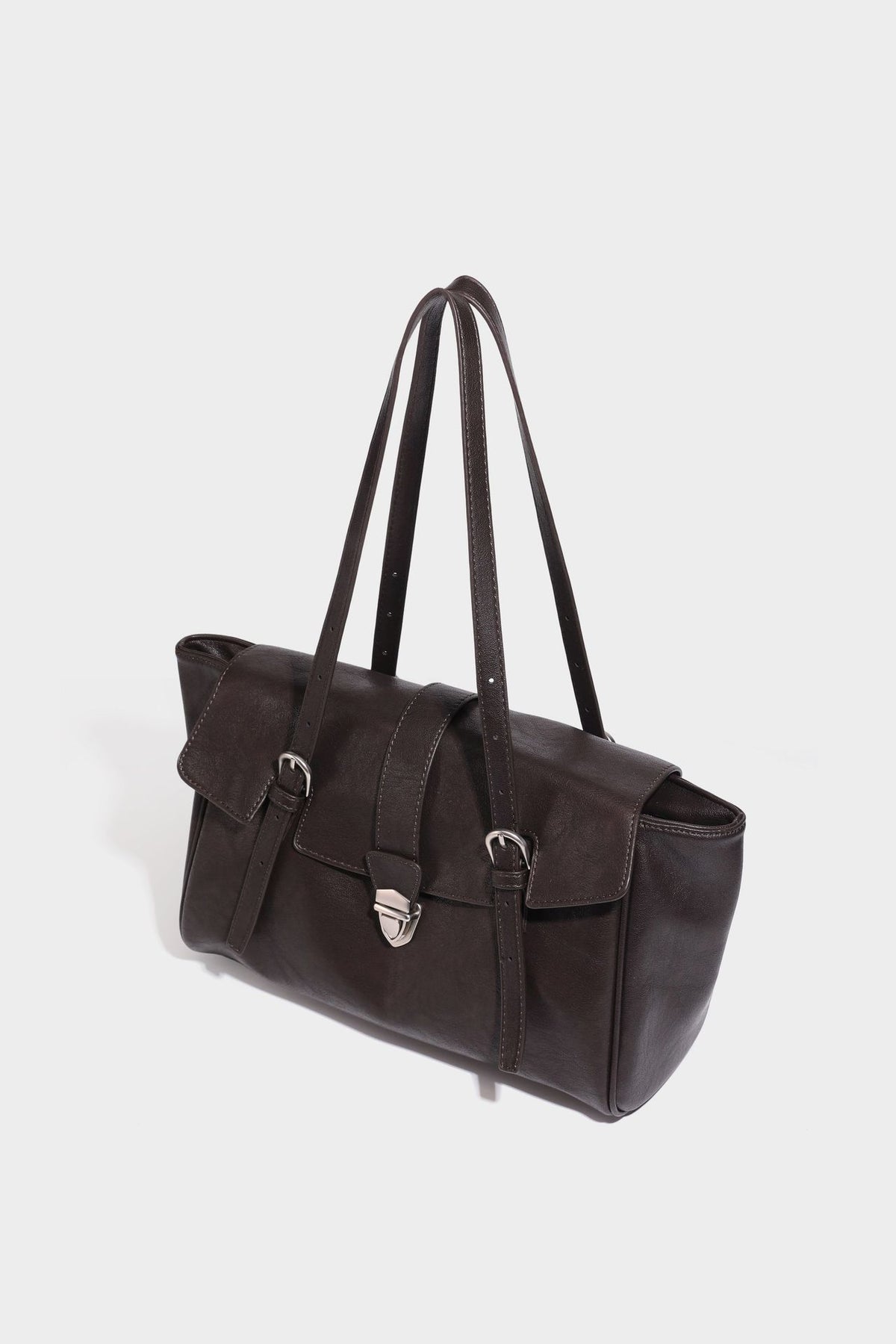 Large structured vintage-style tote bag with flap-front turn-lock closure, twin buckle straps, and double shoulder handles