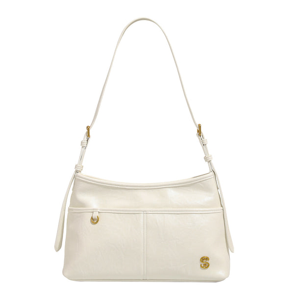 Relaxed leather-look shoulder tote bag in cream white with front exterior pocket, gold-tone ring hardware, and adjustable