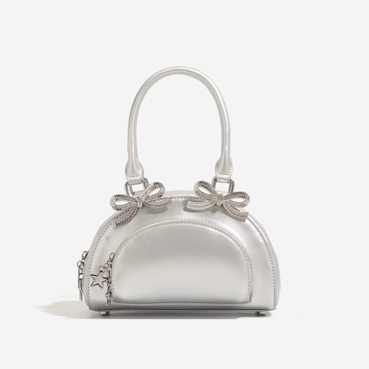 Structured half-moon mini handbag with silver-tone crystal bow hardware and star charm chain, detail view 7