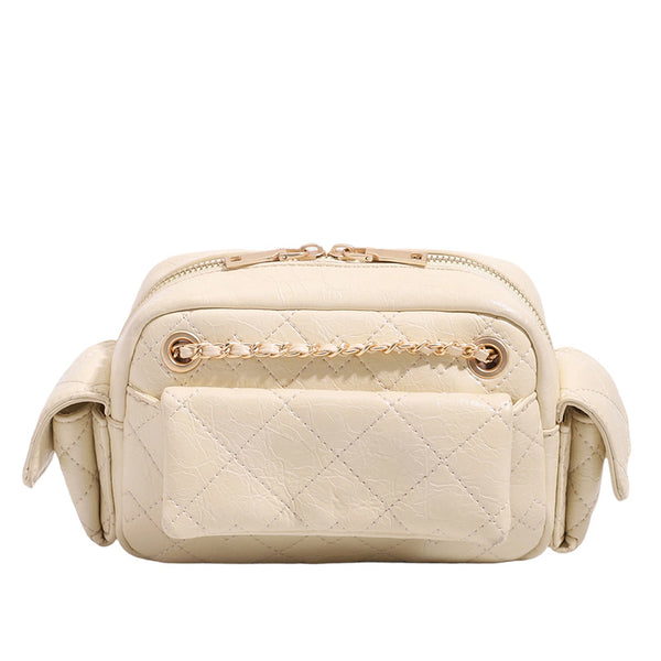 Compact quilted diamond-stitch crossbody bag with gold-tone chain strap and top zip closure, detail view 5