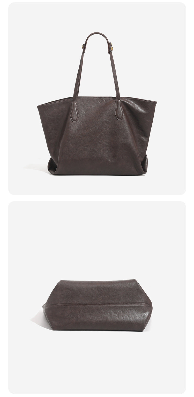 Large leather-look tote bag with trapezoid silhouette, double shoulder straps, and detachable hanging tag, detail view 14