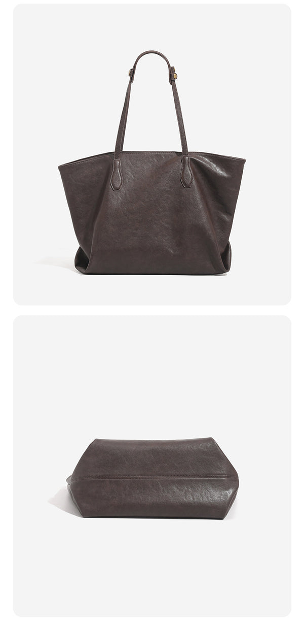 Large leather-look tote bag with trapezoid silhouette, double shoulder straps, and detachable hanging tag, detail view 14