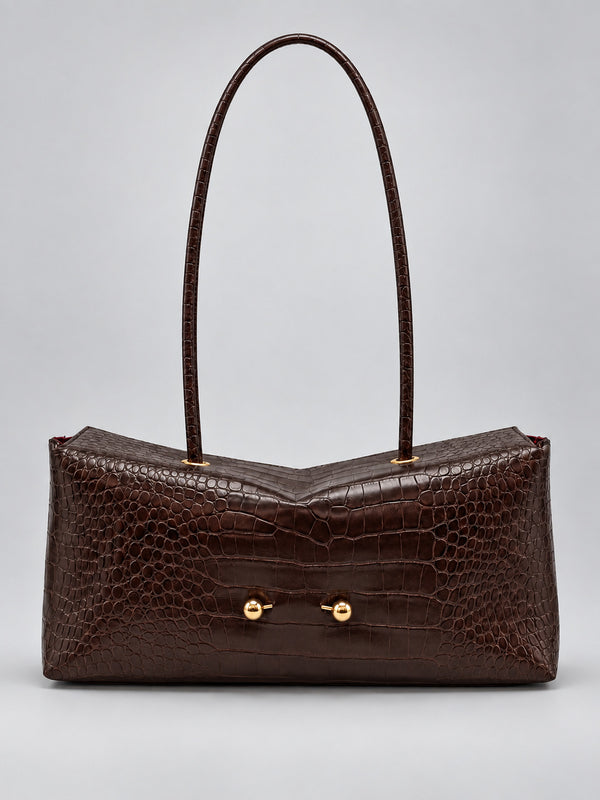 Wide embossed-texture shoulder tote bag with single loop handle and gold-tone toggle hardware, detail view 8