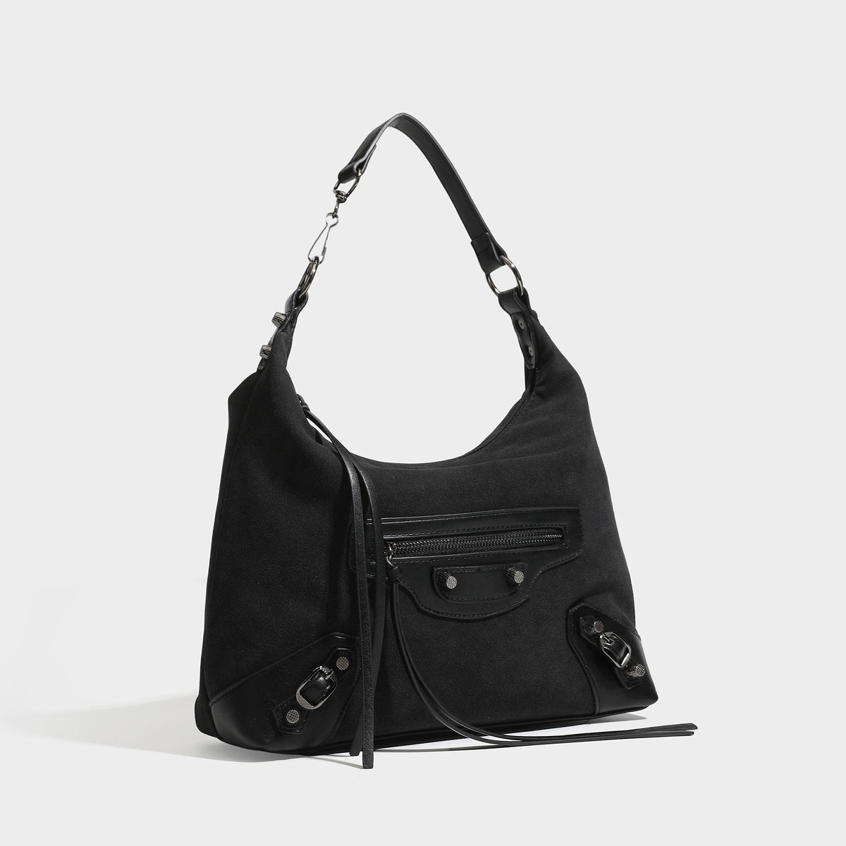 Slouchy suede-finish hobo shoulder bag with dark hardware, exterior zip pocket, tassel ties, and detachable crossbody strap