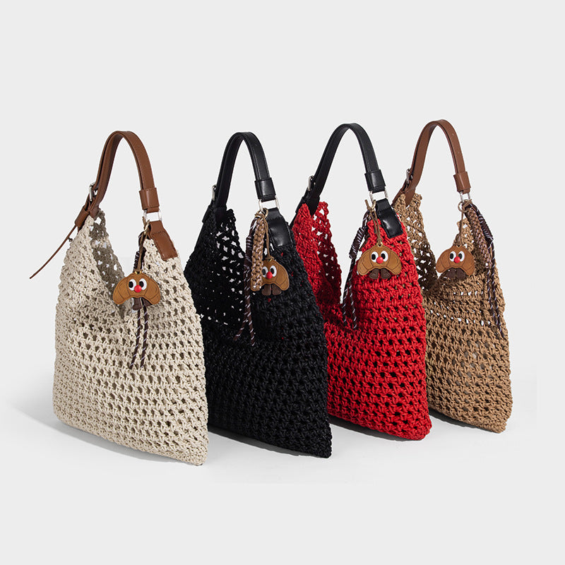 Slouchy open-knit crochet hobo tote bag with leather-look top handle and metal buckle hardware, detail view 2