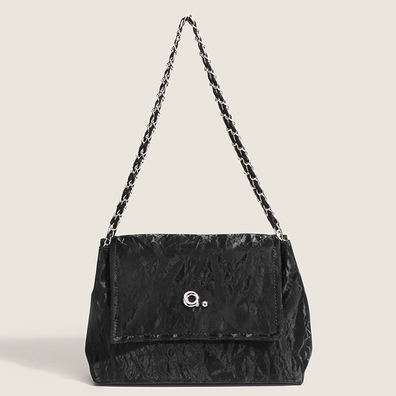 Crinkle-finish leather-look shoulder bag with woven tan-and-metal chain strap and front flap turn-lock closure, detail view 7