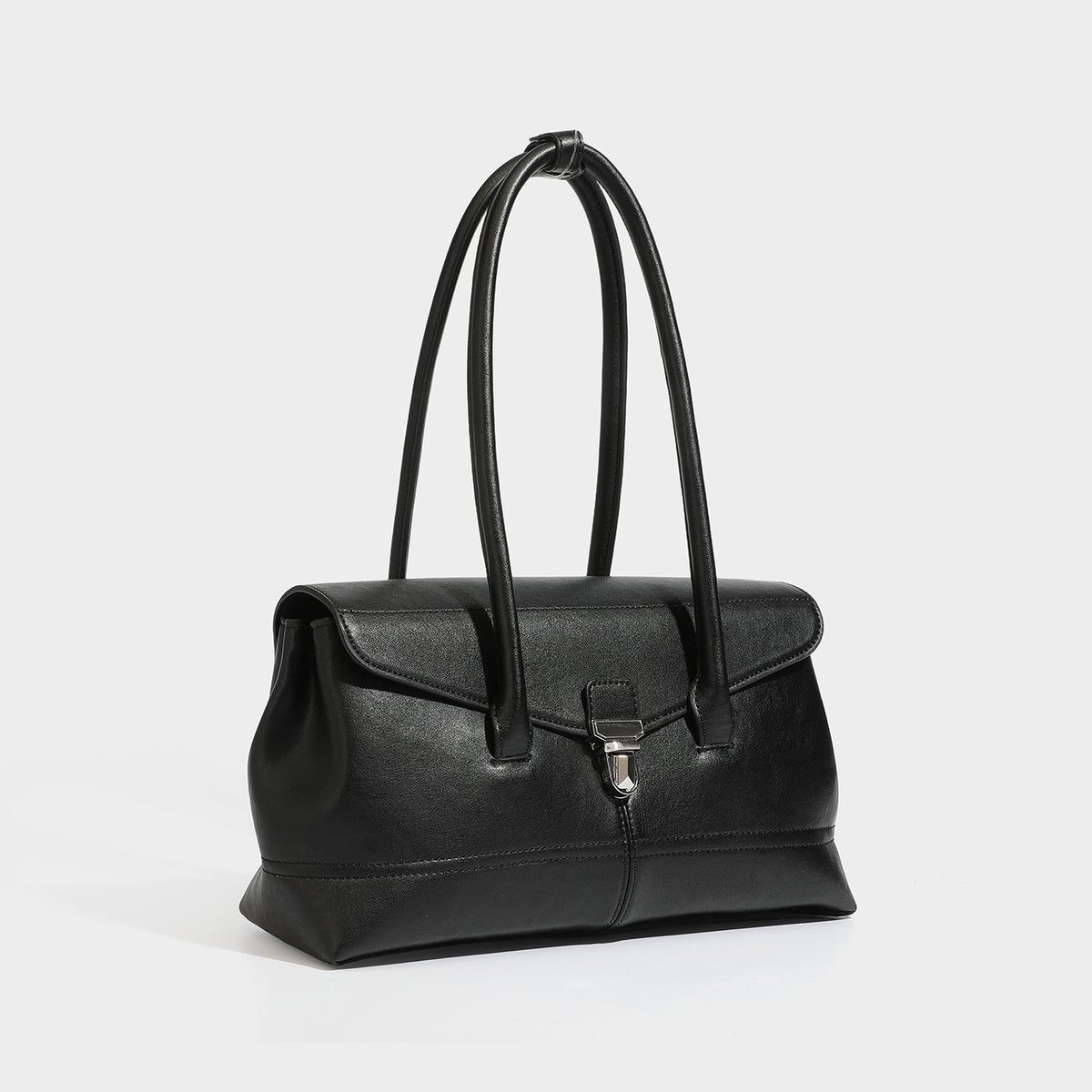 Structured rectangular satchel bag with dual rounded top handles and central metal turn-lock flap closure, detail view 4
