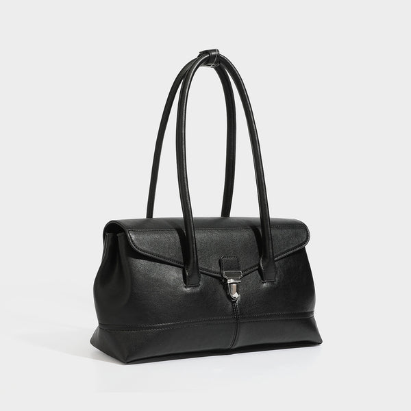 Structured rectangular satchel bag with dual rounded top handles and central metal turn-lock flap closure, detail view 4