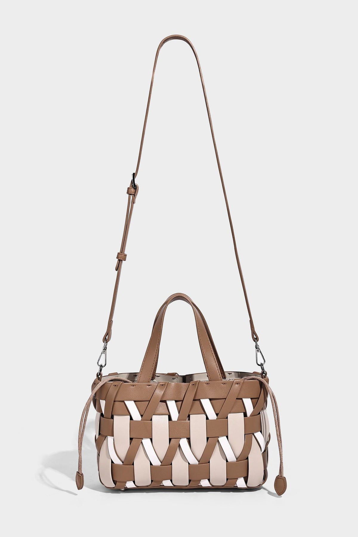 Small structured woven lattice tote bag with dual top handles and detachable shoulder strap in brown and cream leather-look