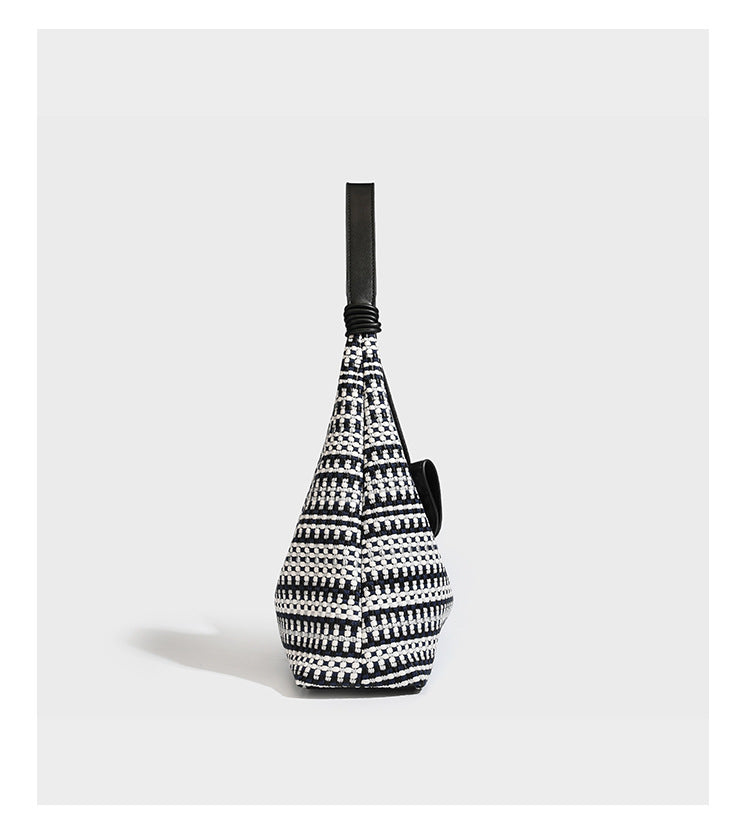 Slouchy woven stripe hobo shoulder bag with black-and-white pattern and leather-look strap, detail view 9