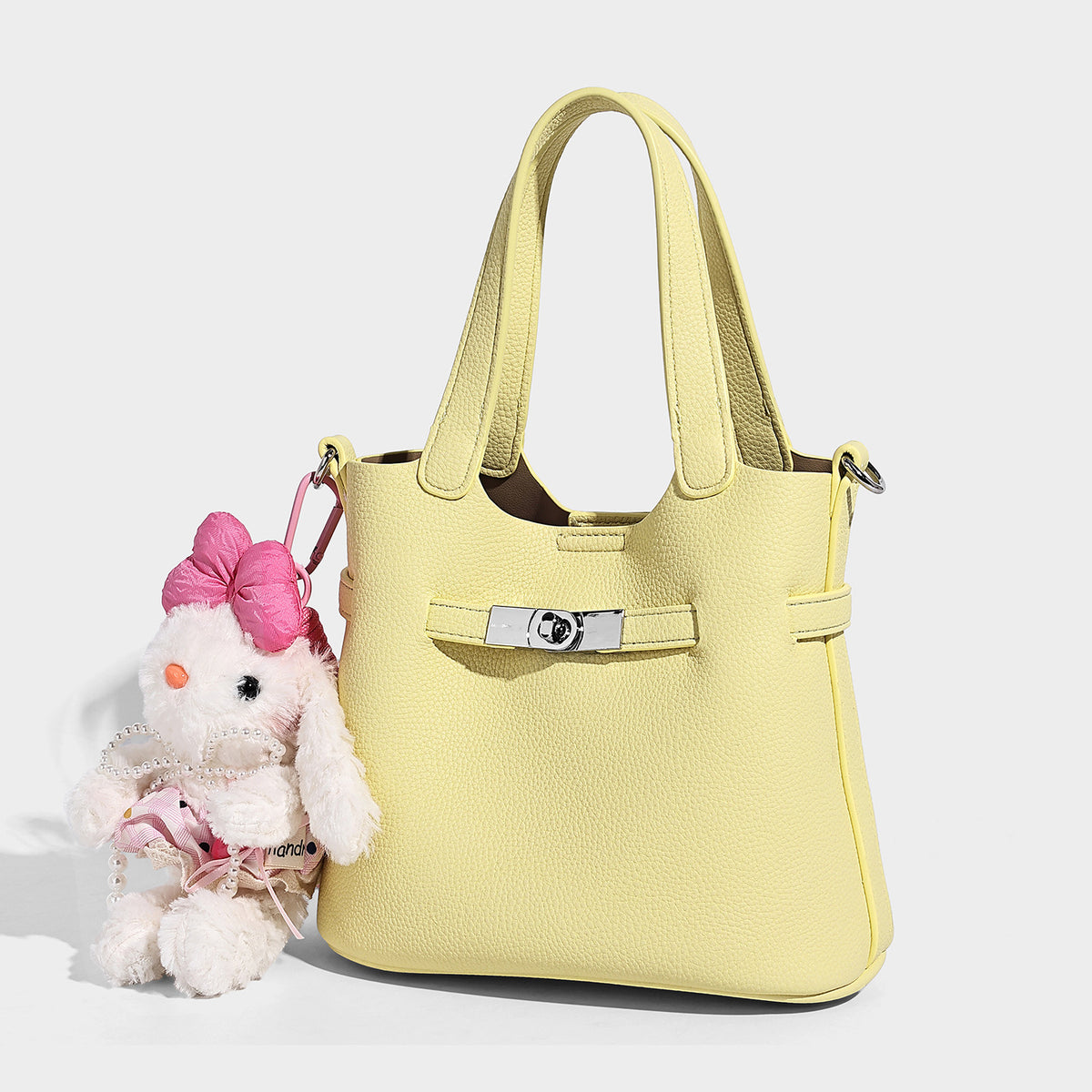 Small structured pebbled-finish tote bag with silver-tone turn-lock hardware and twin top handles, front view
