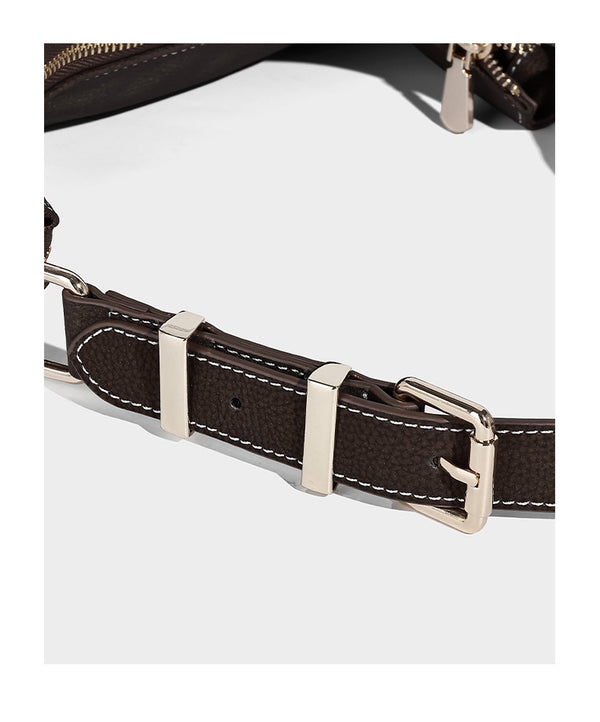 Crescent hobo shoulder bag in pebbled leather-look finish with top zipper, adjustable strap, gold-tone ring hardware, and