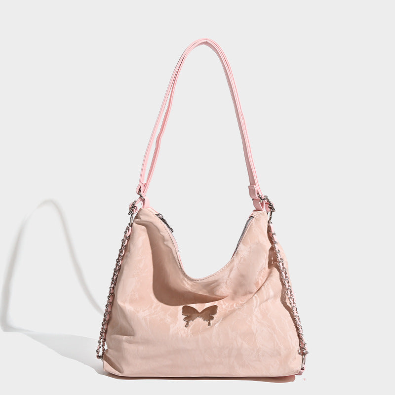 Crinkle-finish hobo shoulder bag with silver-tone chain side panels and butterfly embellishment, detail view 8