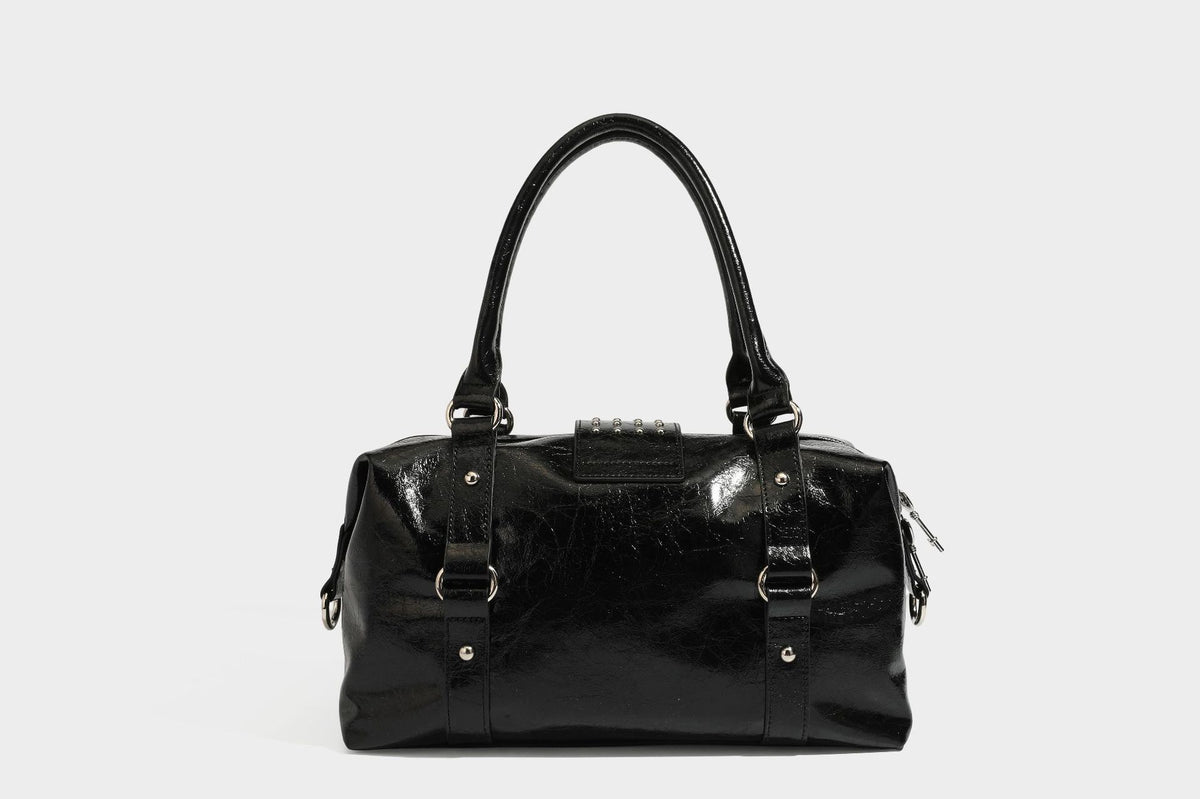 Glossy crinkled barrel handbag with silver stud buckle strap and detachable shoulder strap, detail view 28
