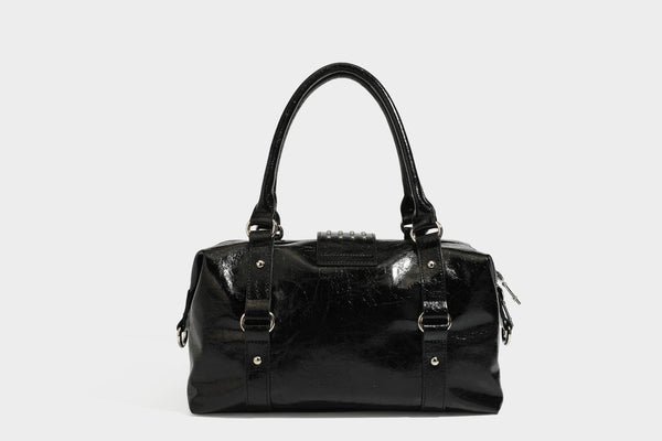 Glossy crinkled barrel handbag with silver stud buckle strap and detachable shoulder strap, detail view 28