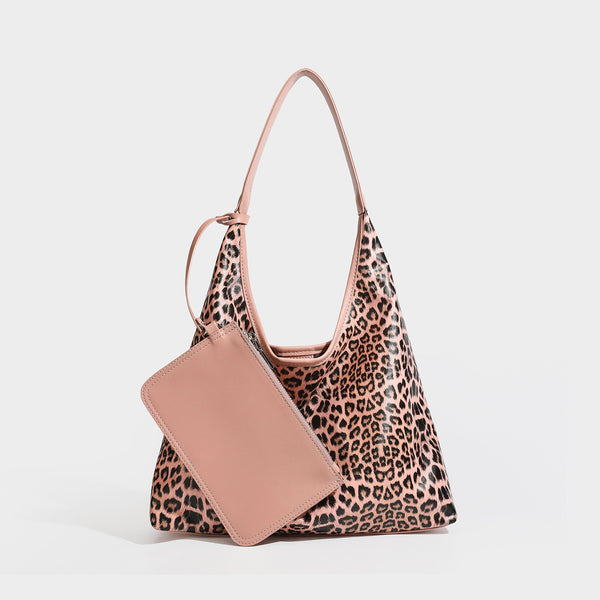Glossy leopard-print slouchy shoulder bag with long strap and detachable tan zip pouch, detail view 2