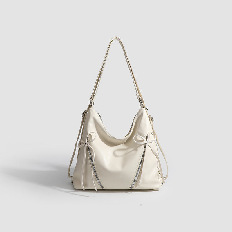 Slouchy hobo shoulder bag with bow detail and silver-tone hardware, detail view 8