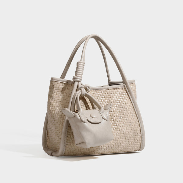 Strukturierte Tote Bag mit Webstruktur in Braun, glatten Besätzen in Lederoptik, geknoteten Tragegriffen und befestigtem Mini-Beutel mit Kordelzug