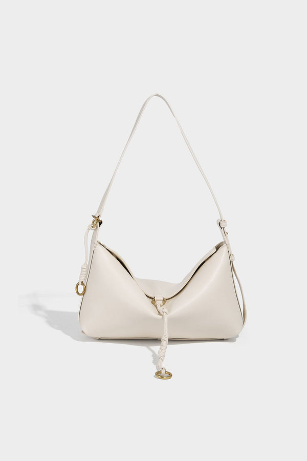 Slouchy brown leather-look shoulder bag with knotted drawcord tie closure, gold-tone ring hardware, and long adjustable