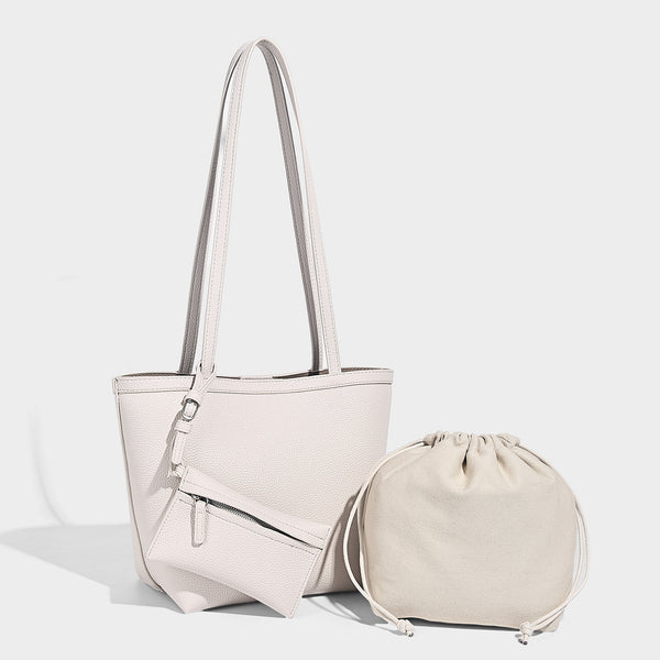 Structured pebbled leather-look tote bag in taupe with long shoulder strap, detachable zip pouch, and pink tulip flower