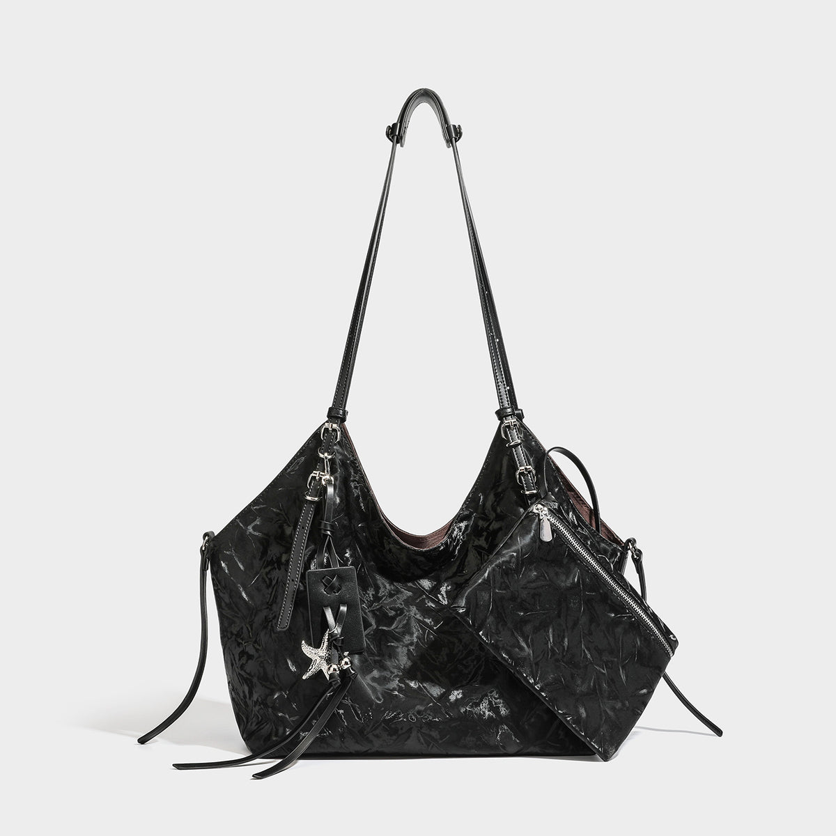 Slouchy crinkle-finish shoulder tote bag with silver hardware and attached zip pouch, detail view 2