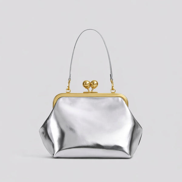 Oversized kiss-lock frame handbag with gold-tone metal clasp and smooth leather-look finish, detail view 14