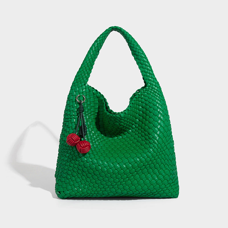 Soft hand-woven slouchy hobo tote bag with knotted tassel charm and single looped shoulder strap, detail view 16