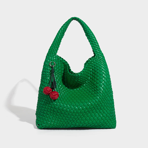Soft hand-woven slouchy hobo tote bag with knotted tassel charm and single looped shoulder strap, detail view 16