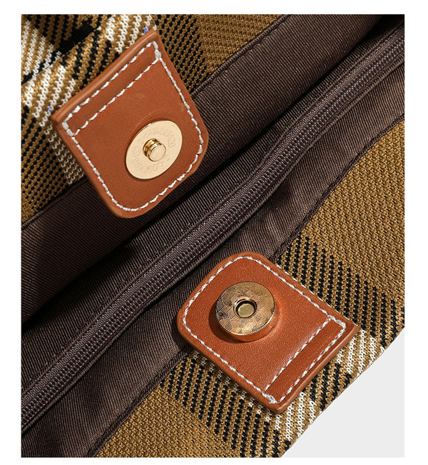 Large structured plaid check tote bag with smooth tan leather-look shoulder straps, attached front zip pouch, and gold-tone