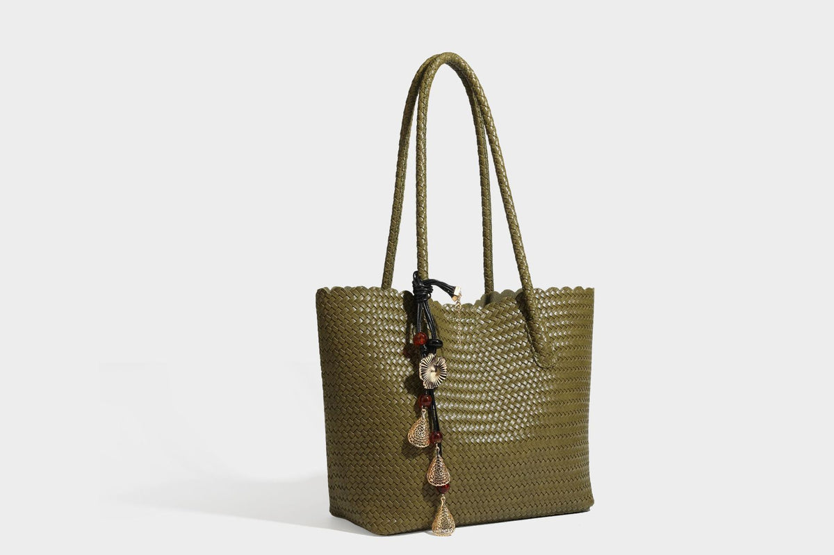 Large open-top woven leather-look tote bag in dark brown with scalloped edge, braided double shoulder straps, and decorative