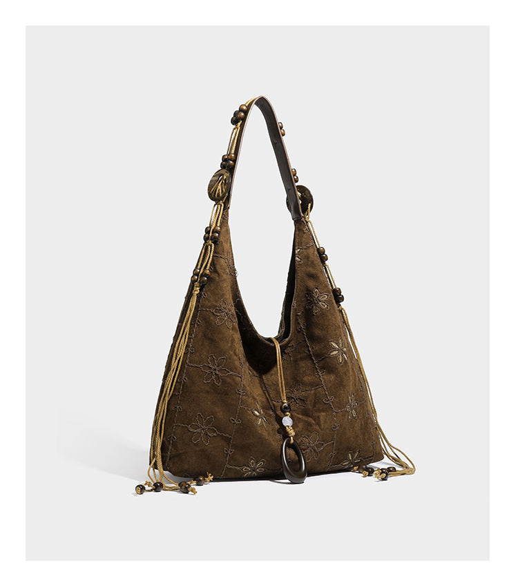 Dunkelbraune bestickte Hobo-Tote-Bag mit Schulterriemen in Lederoptik und Perlen, geknoteten Quastenbändern und ovalen Ringbeschlägen