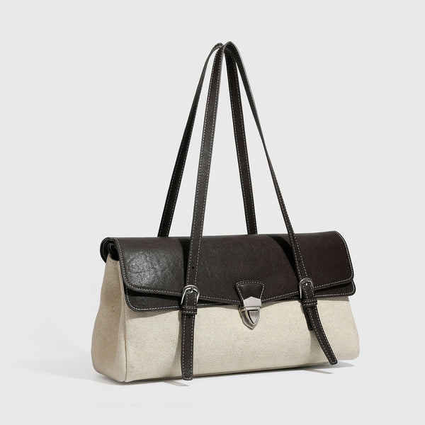 Strukturierte zweifarbige Schultertasche mit schwarzer Klappe in Lederoptik, cremefarbenem Korpus mit Webstruktur, silberfarbenem Drehverschluss und Doppel