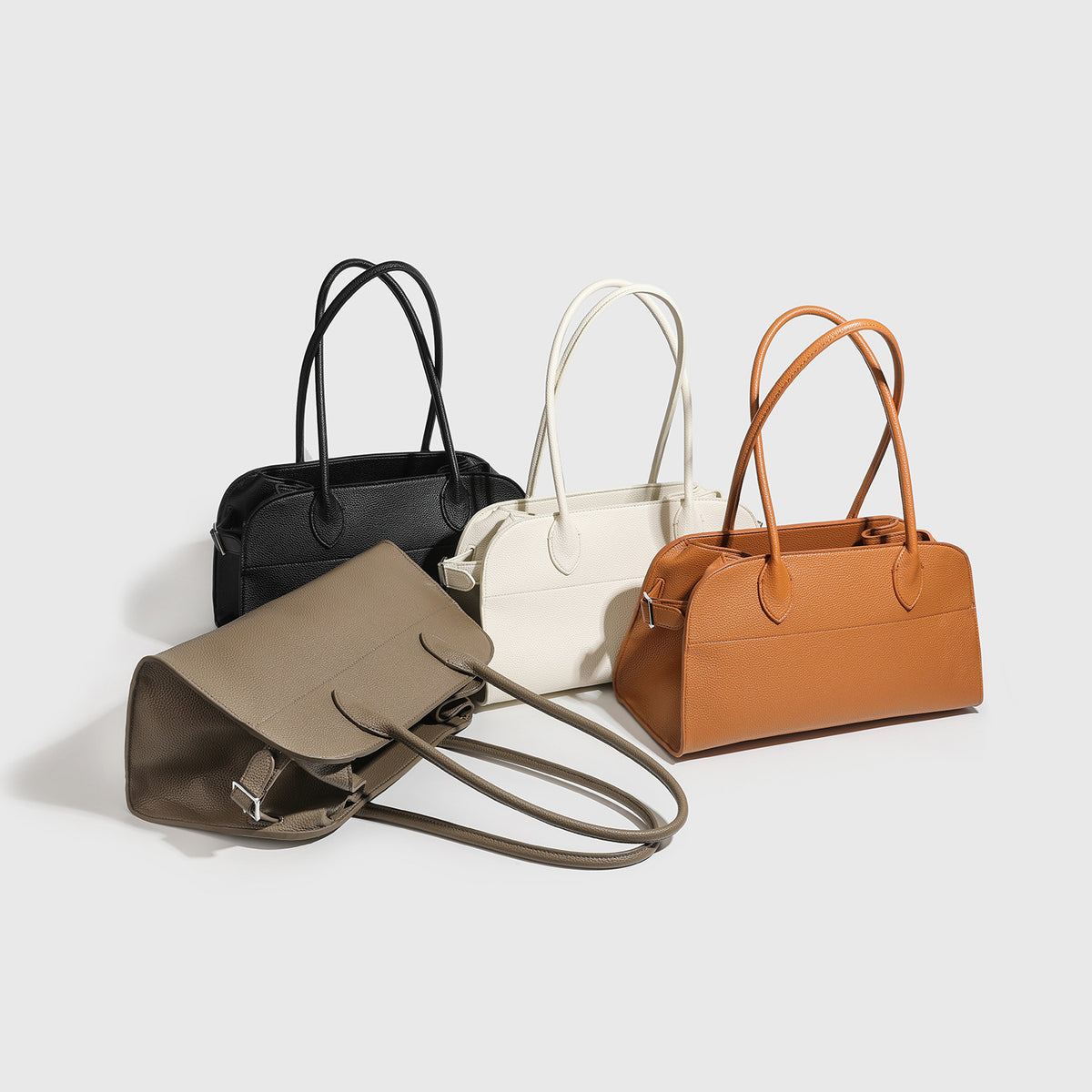 Large structured pebbled leather-look tote bag with double top handles and silver-tone hardware, detail view 4