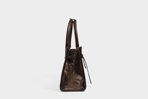Structured leopard-print tote bag with glossy satin-like finish, dual rounded top handles, silver buckle-and-ring front