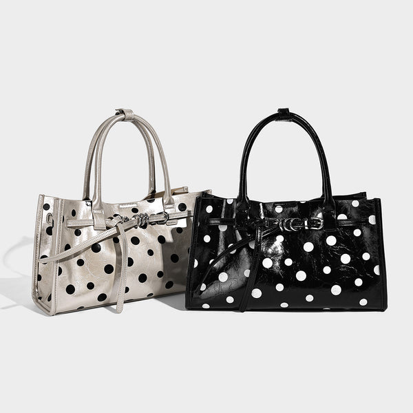 Structured glossy leather-look polka-dot satchel tote with dual top handles and detachable shoulder strap, detail view 2