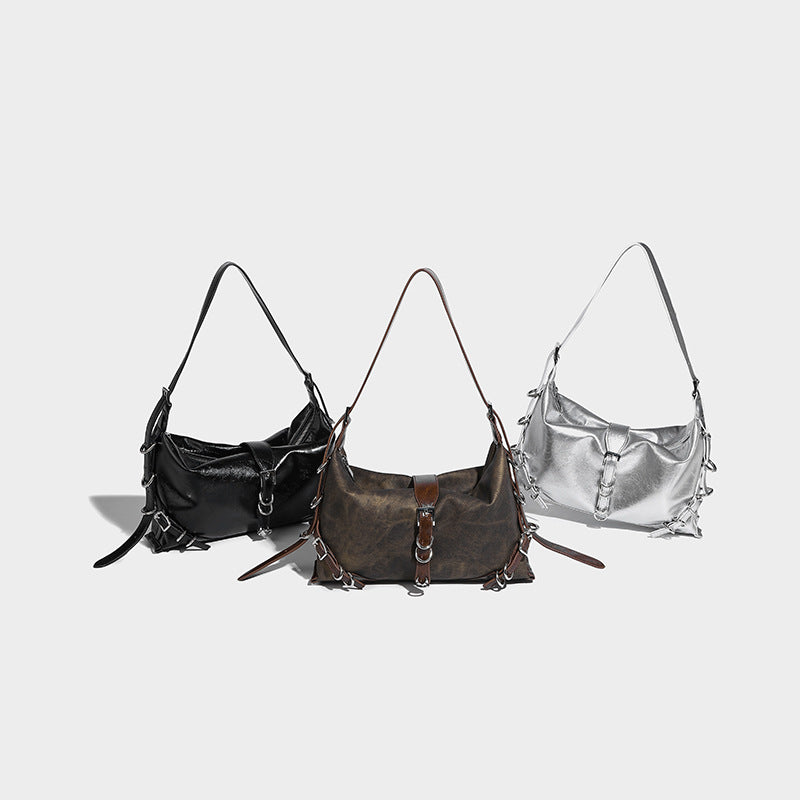 Slouchy hobo shoulder bag with distressed finish, silver-tone ring and buckle hardware, and adjustable strap, detail view 2