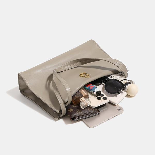 Smooth leather-look slouchy trapezoid shoulder tote with gold-tone gourd clasp hardware and long slim straps, detail view 3