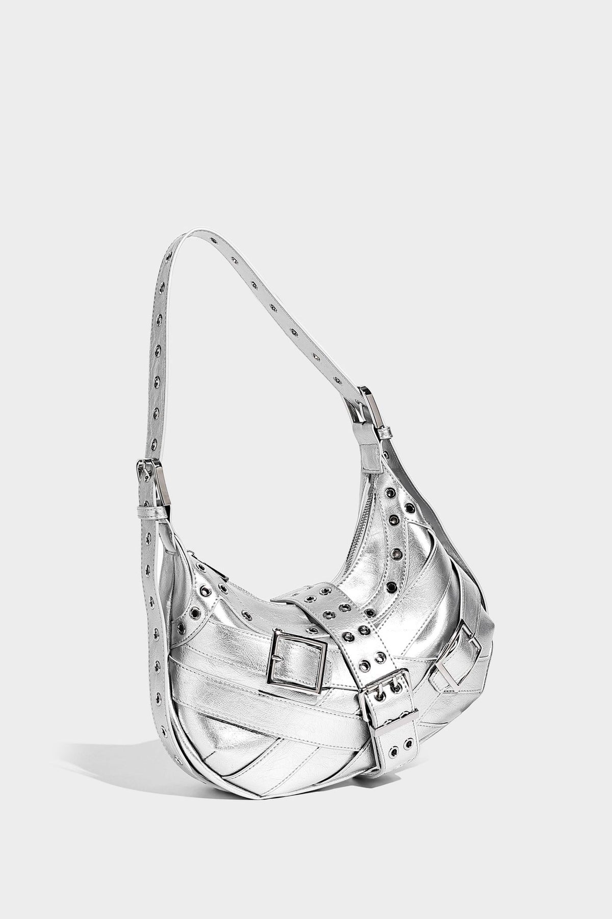 Glossy crescent hobo bag with silver-tone grommets, square buckle straps, and top zipper closure, detail view 14