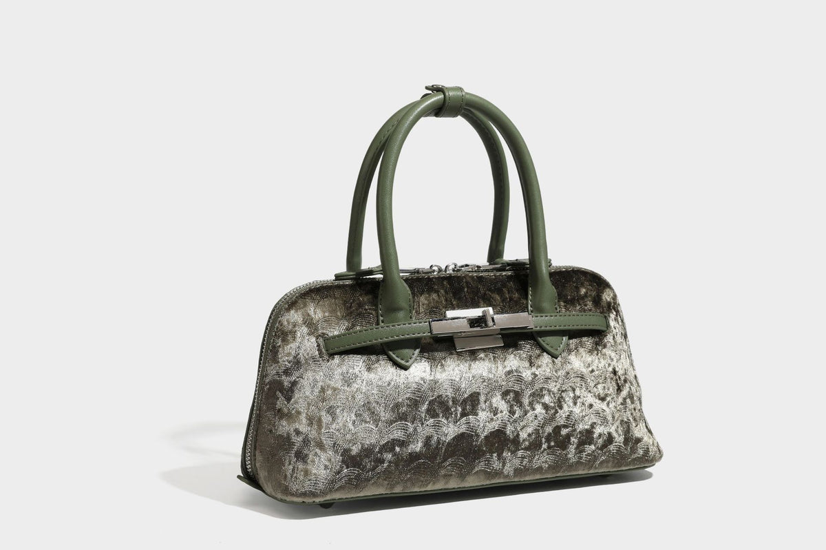 Small structured satchel bag in dark brown velvet-like textured finish with leather-look trim, silver-tone turn-lock bar