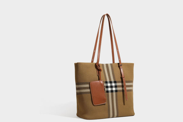 Large structured plaid check tote bag with smooth tan leather-look shoulder straps, attached front zip pouch, and gold-tone