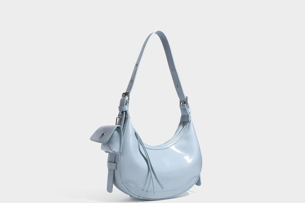 Glossy leather-look crescent hobo shoulder bag with dark contrast trim, silver-tone hardware, and attached mini flap pouch