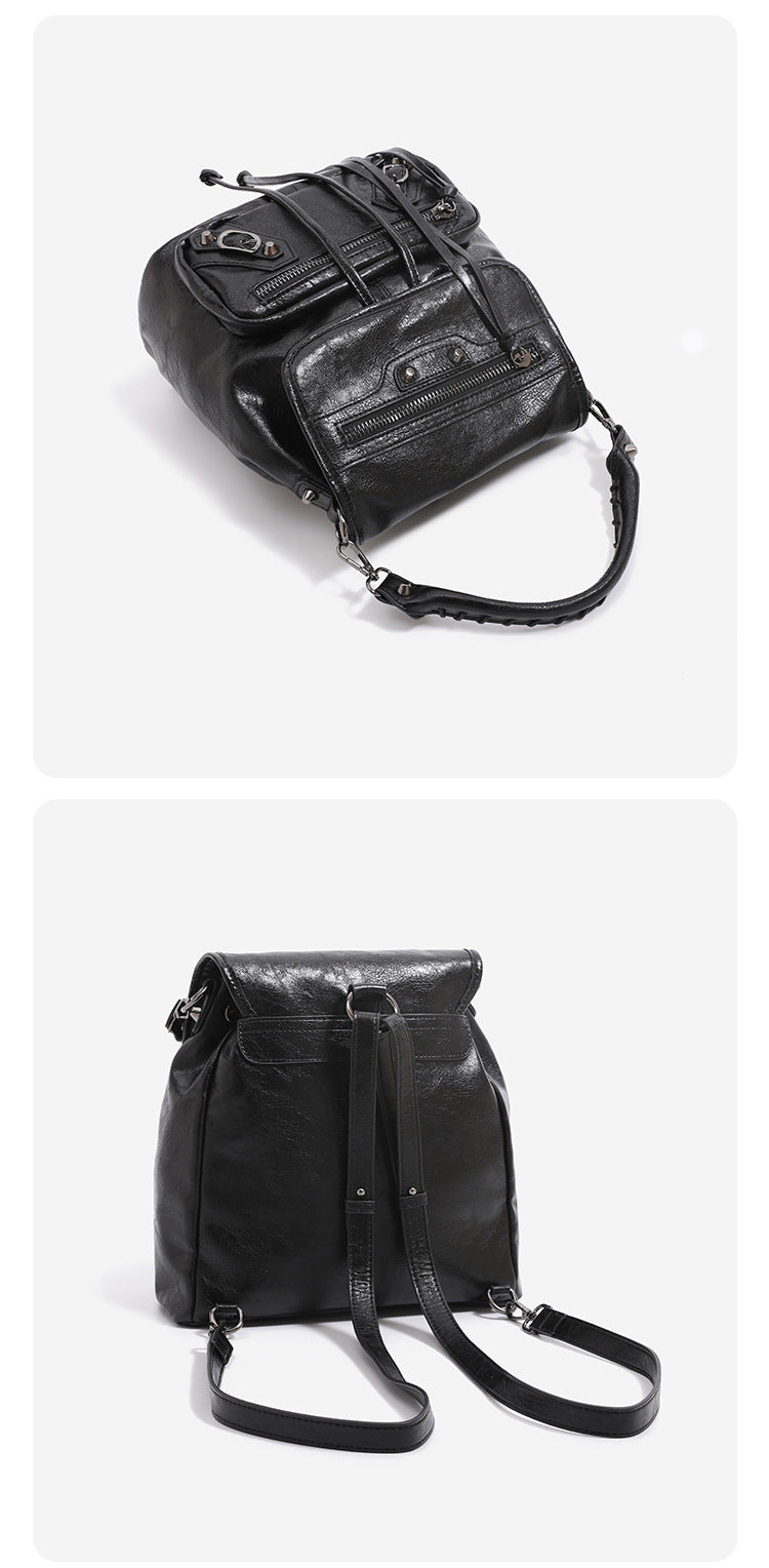 Mini flap backpack handbag with silver stud hardware, front zip pockets, and drawstring tassels, detail view 12