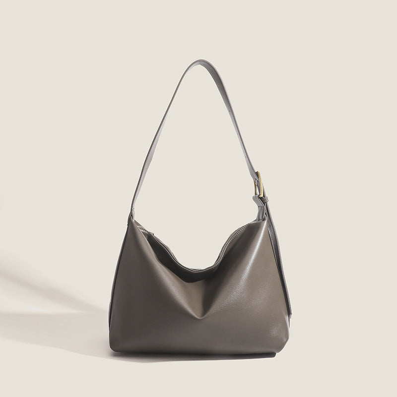 Large slouchy hobo shoulder bag in smooth leather-look finish with single long strap and gold-tone zip closure, detail view 7
