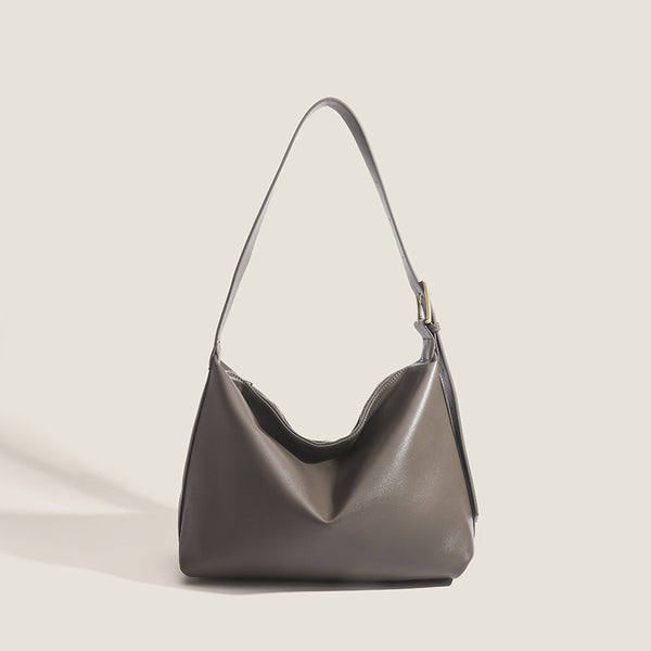 Large slouchy hobo shoulder bag in smooth leather-look finish with single long strap and gold-tone zip closure, detail view 7