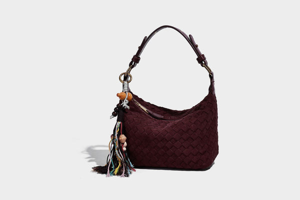 Small woven-texture crescent hobo bag in dark chocolate brown with top zip closure, gold-tone hardware, and adjustable